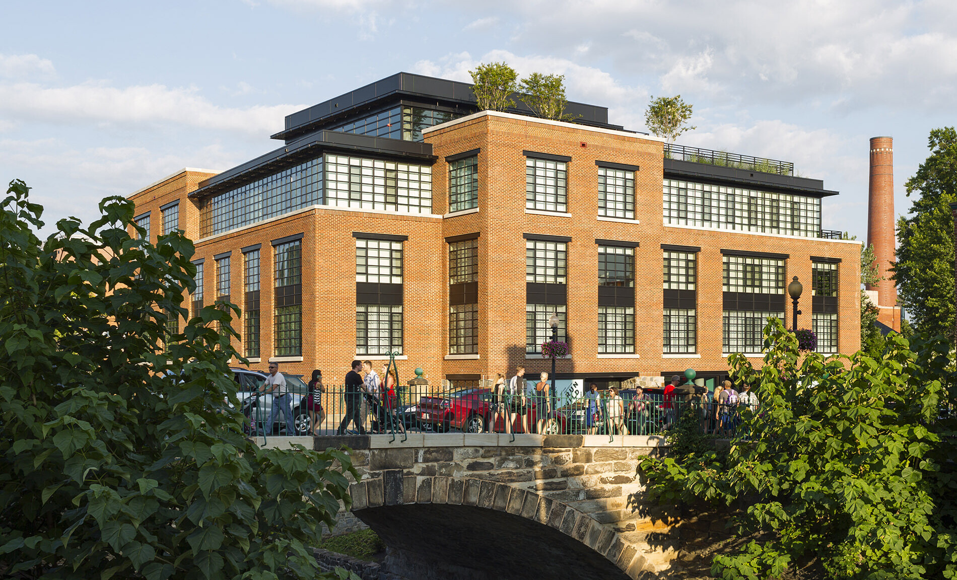 View looking South with historic industrial chimney in the background.